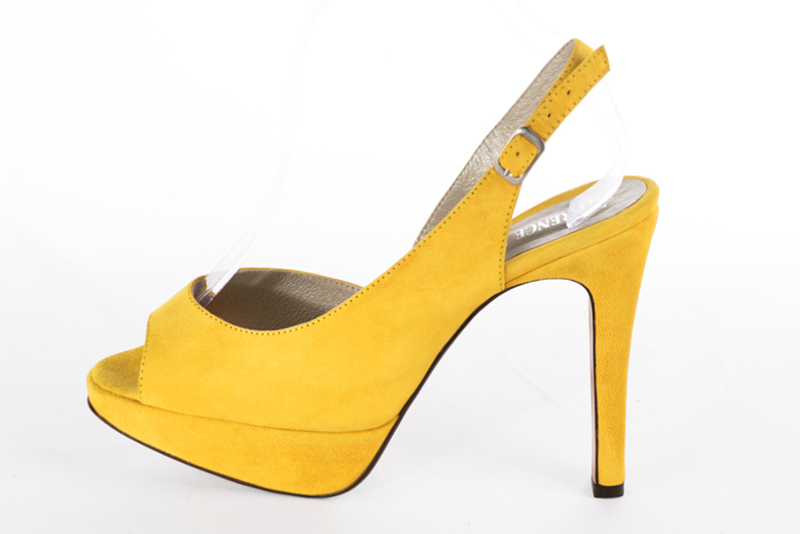 Yellow women's slingback sandals. Round toe. Very high slim heel with a platform at the front. Profile view - Florence KOOIJMAN